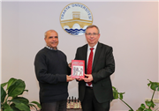 TURAN ŞALLI, İLK KİTABINI REKTÖR PROF. DR. ERHAN TABAKOĞLU’NA TAKDİM ETTİ