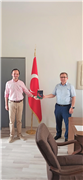 ÖĞR. GÖR. DR. ÖZDEMİR AKBAL, REKTÖR PROF. DR. ERHAN TABAKOĞLU’NA KİTABINI TAKDİM ETTİ